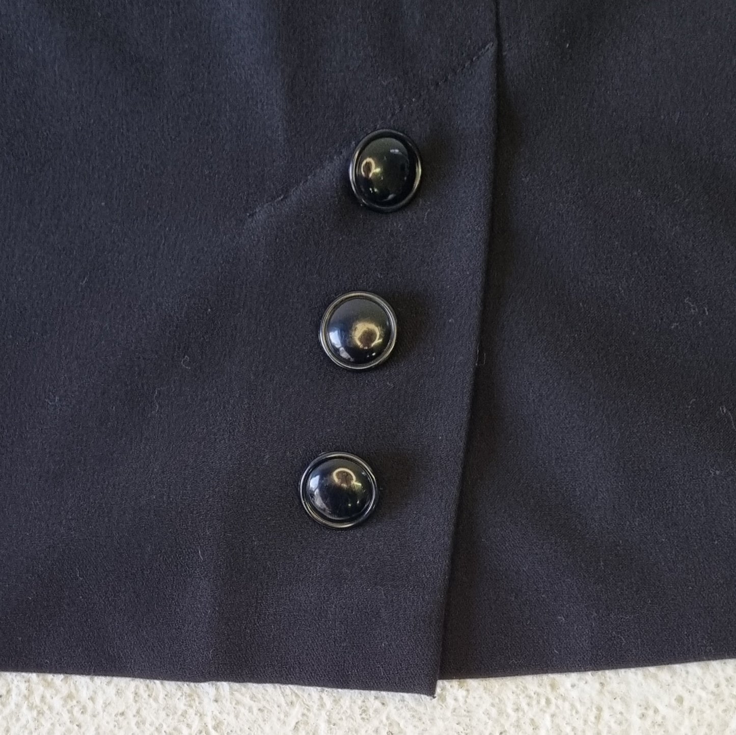 Charlotte - Black lined mini skirt with buttoned back slit