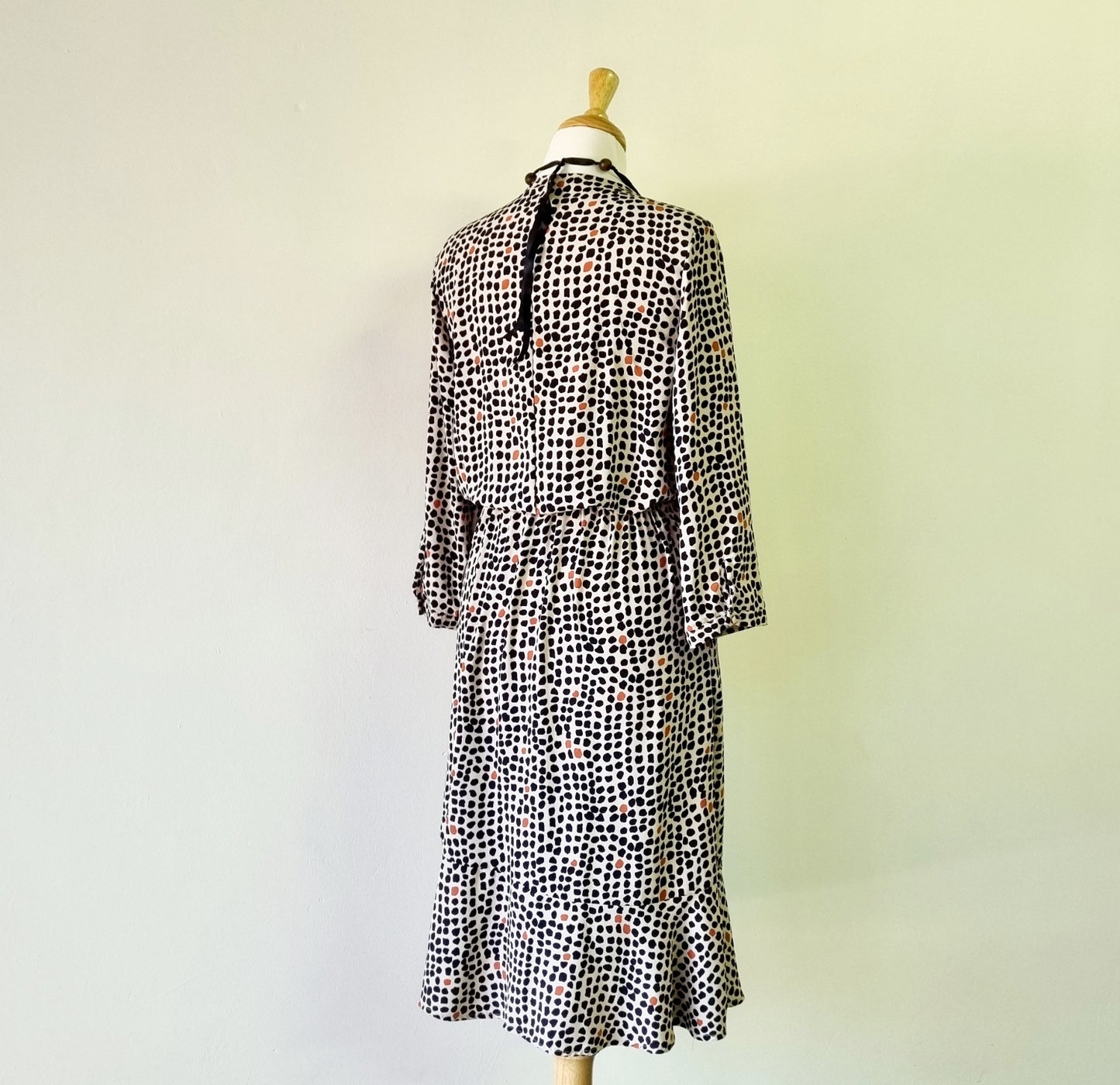 Real Woman - Black, beige & orange dotted print elastic waisted wrap dress.