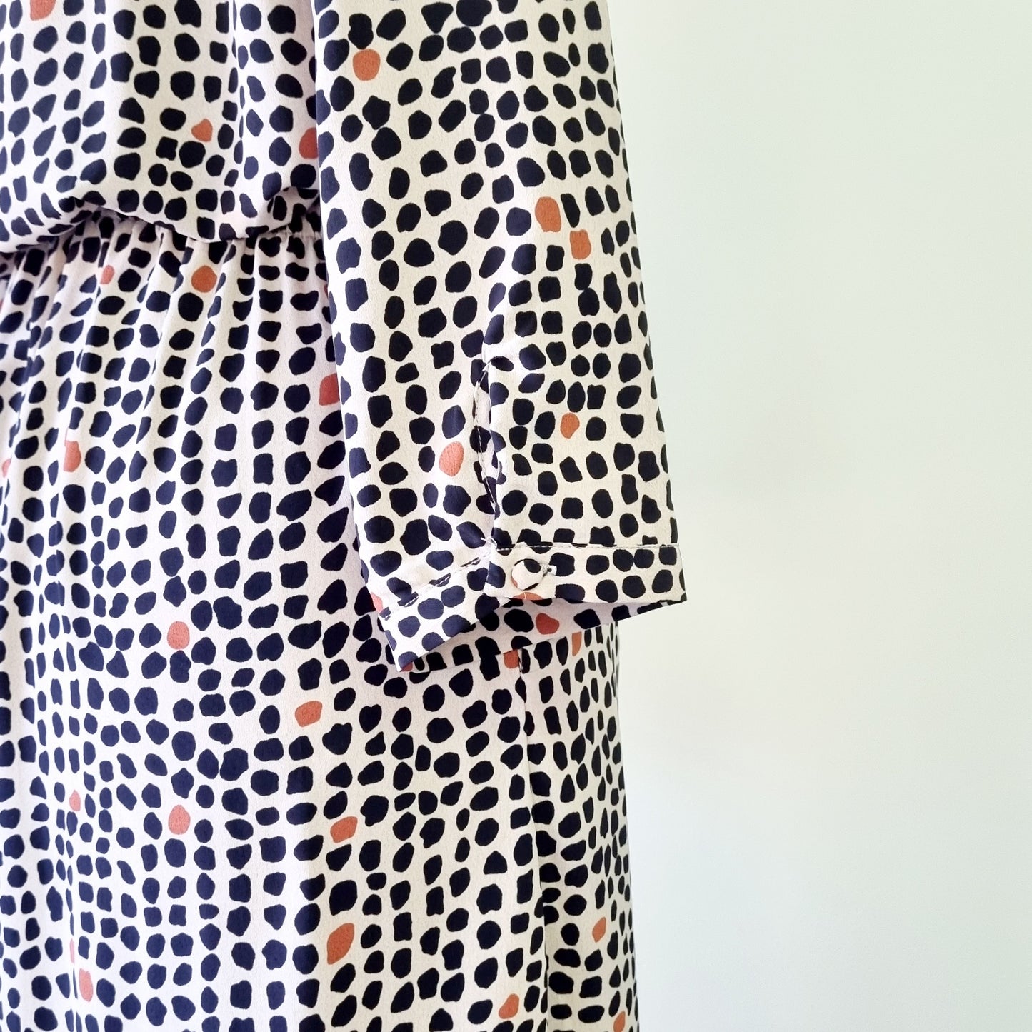 Real Woman - Black, beige & orange dotted print elastic waisted wrap dress.