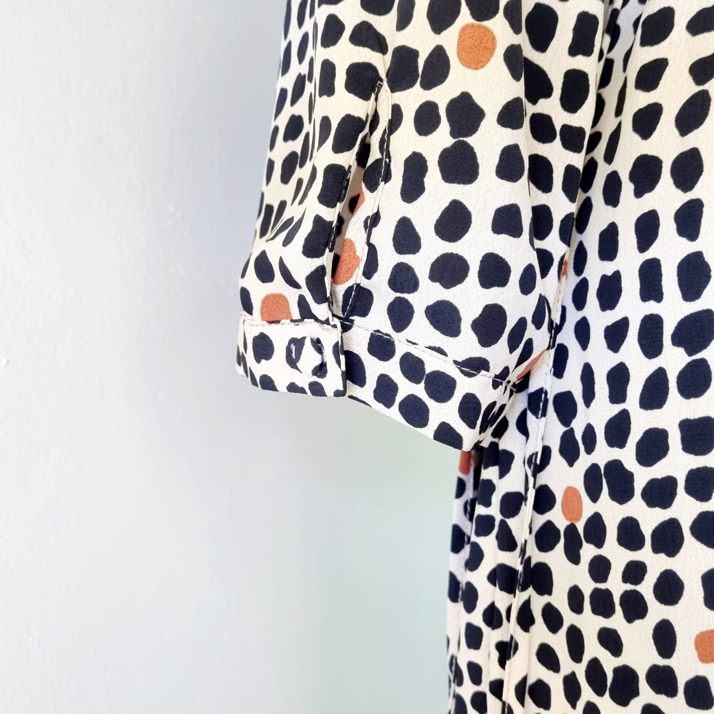 Real Woman - Black, beige & orange dotted print elastic waisted wrap dress.