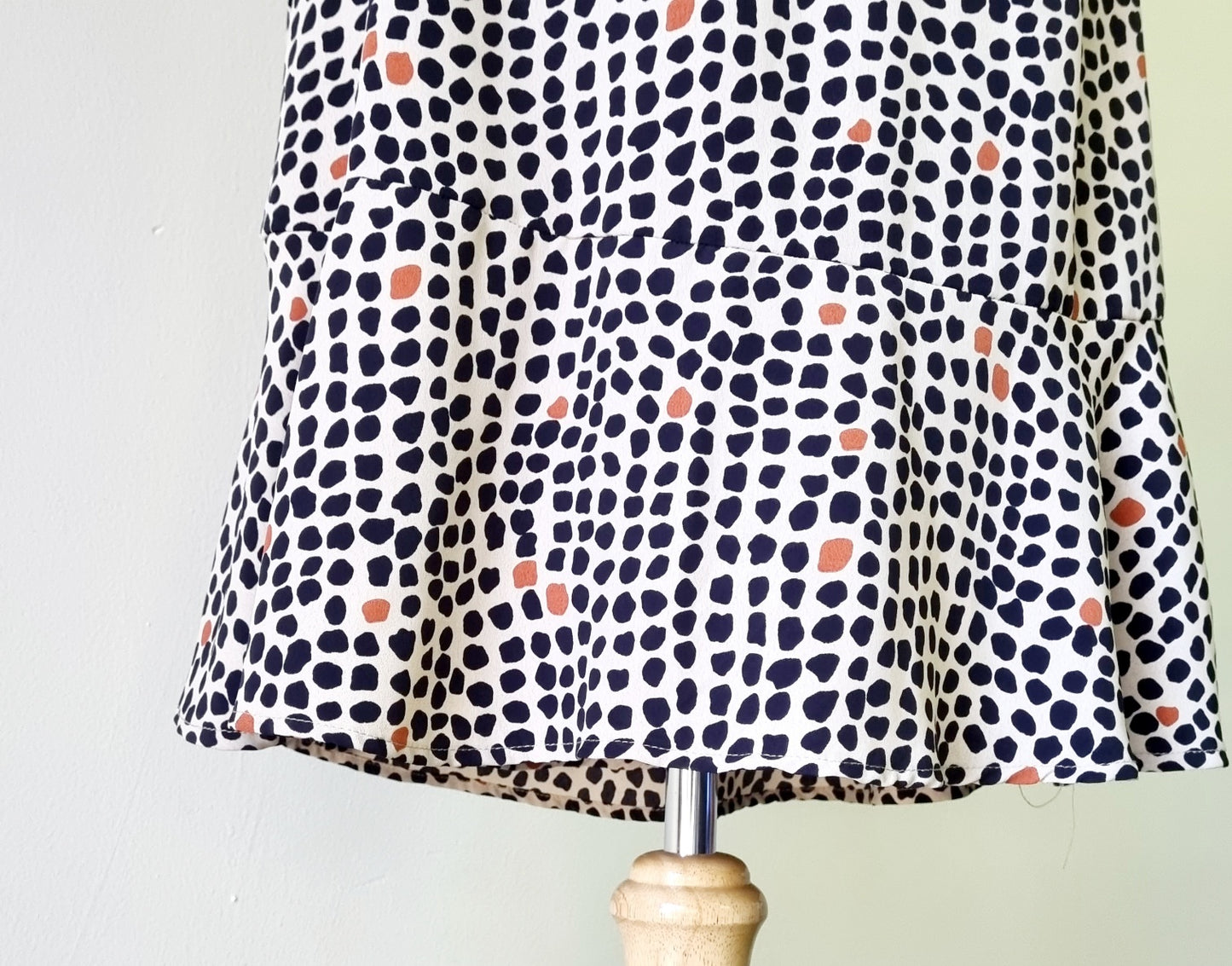 Real Woman - Black, beige & orange dotted print elastic waisted wrap dress.