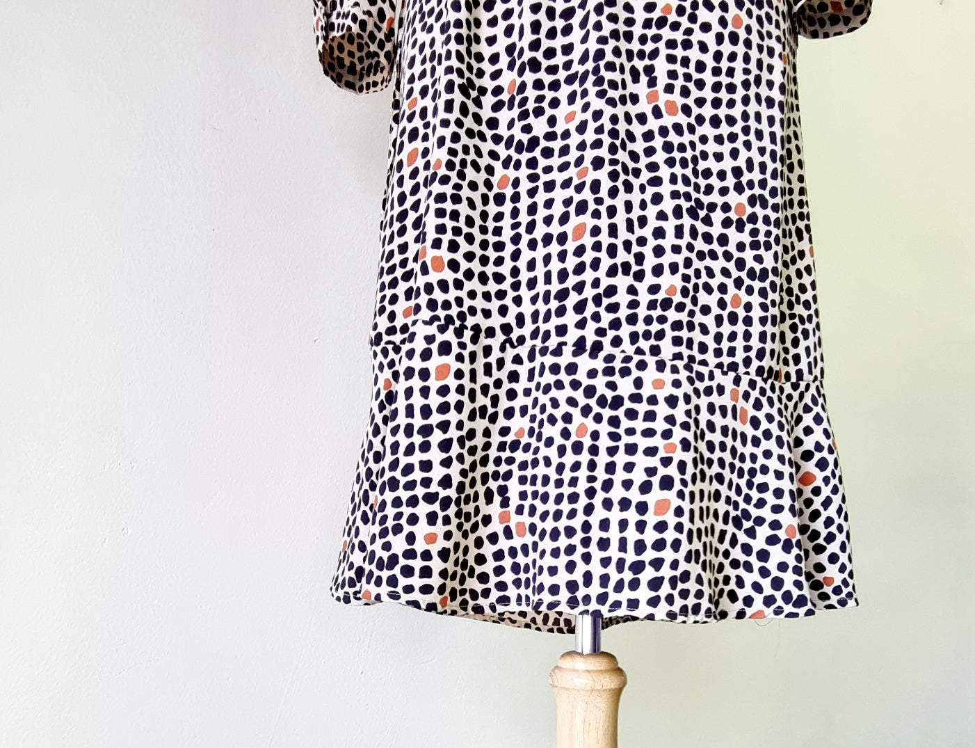 Real Woman - Black, beige & orange dotted print elastic waisted wrap dress.