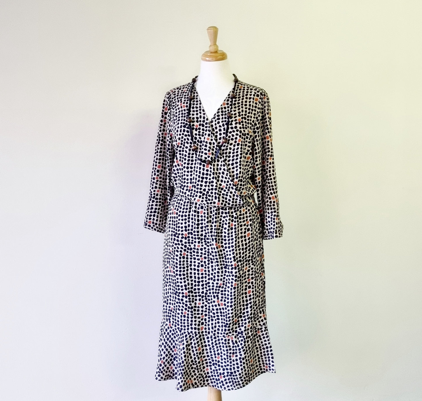 Real Woman - Black, beige & orange dotted print elastic waisted wrap dress.